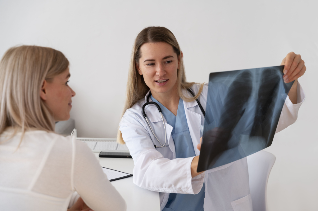 medium-shot-smiley-doctor-holding-radiography (1).jpg